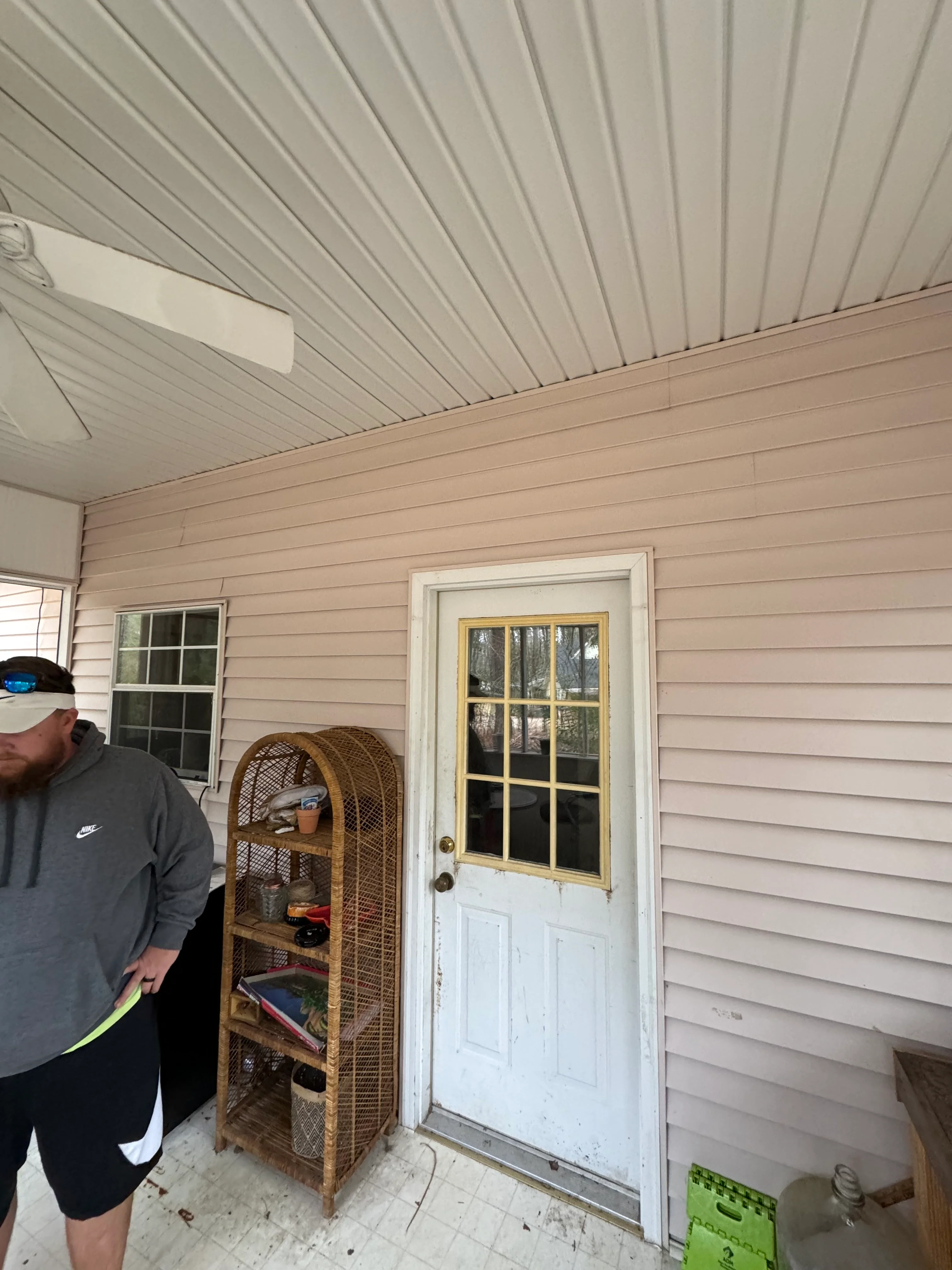 Newly constructed covered porch with metal roof and vinyl siding in New Orleans